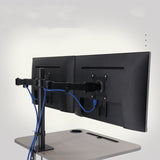 Black dual monitor stand with two monitors on a white background