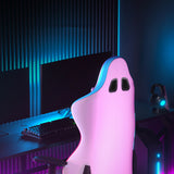 Pink ghost-shaped desk lamp on a gaming setup with monitors and keyboard. back