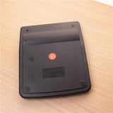 Black electronic device with a red logo on a wooden surface