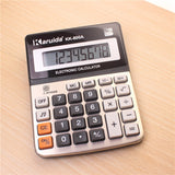 KARUIDA electronic calculator on a wooden surface